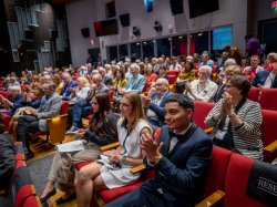 The audience applauds