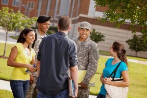 Group of students talk with ROTC cadet.