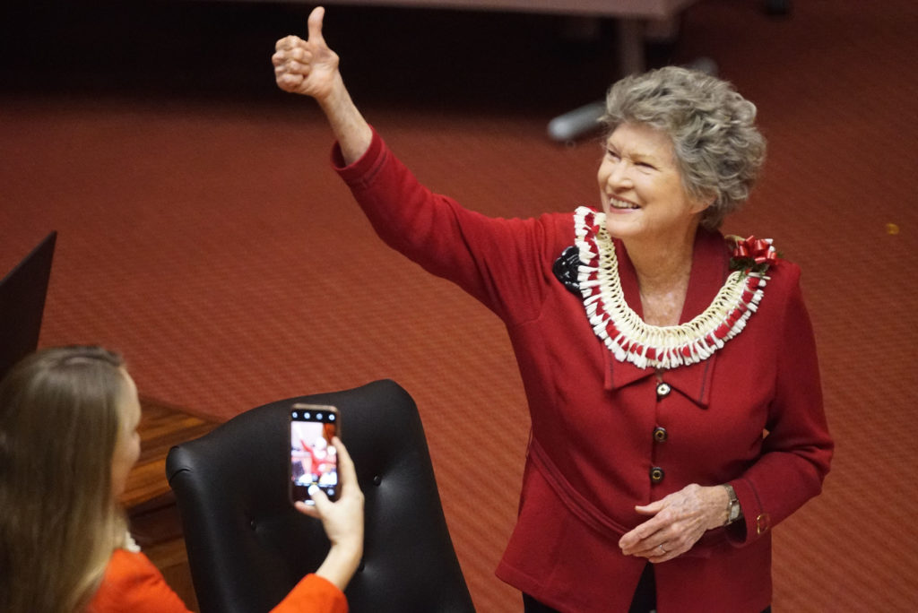 2020 Legislature Rep Cynthia Thielen rises with a thumbs up during opening session.