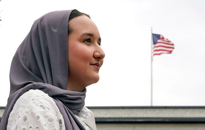 Northeastern University student Mashal Aziz poses on campus, Friday, July 21, 2023, in Boston. Aziz was just months away from graduating from college in Afghanistan when she found herself rushing to the airport to leave the country as the Taliban swept into power. Universities and colleges across the U.S. have scrambled to find ways to help students, like Aziz, to continue their education. (AP Photo/Charles Krupa)