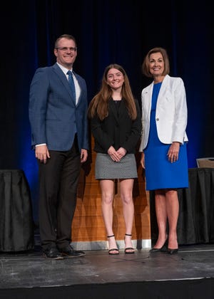 Elizabeth Grell of Woodward-Granger High School is recognized by Lt. Gov. Adam Gregg and Gov. Kim Reynolds during the Governor’s Scholar Recognition Ceremony on April 28, 2024.