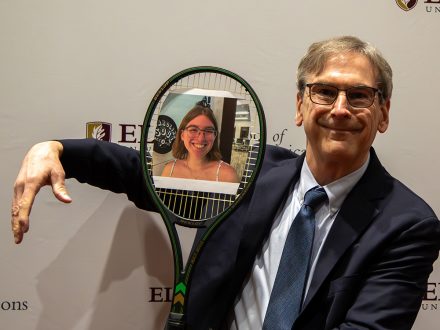 Anthony Hatcher holds a tennis racket.