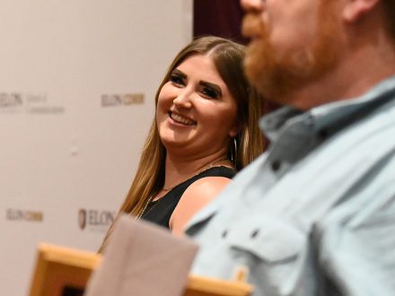 Katie Bennert smiles looking at the camera.