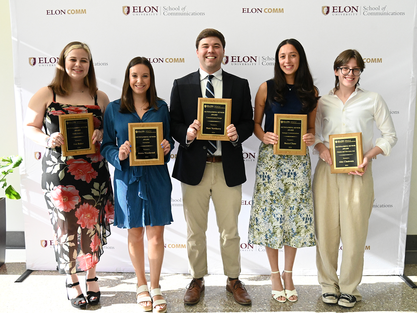 Five students stand with their Outstanding Senior Awards.