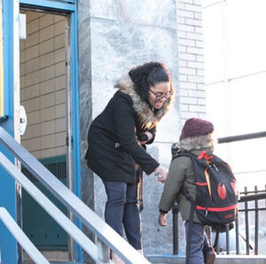 Mallorie Bocachica ’10 greeting a student.
