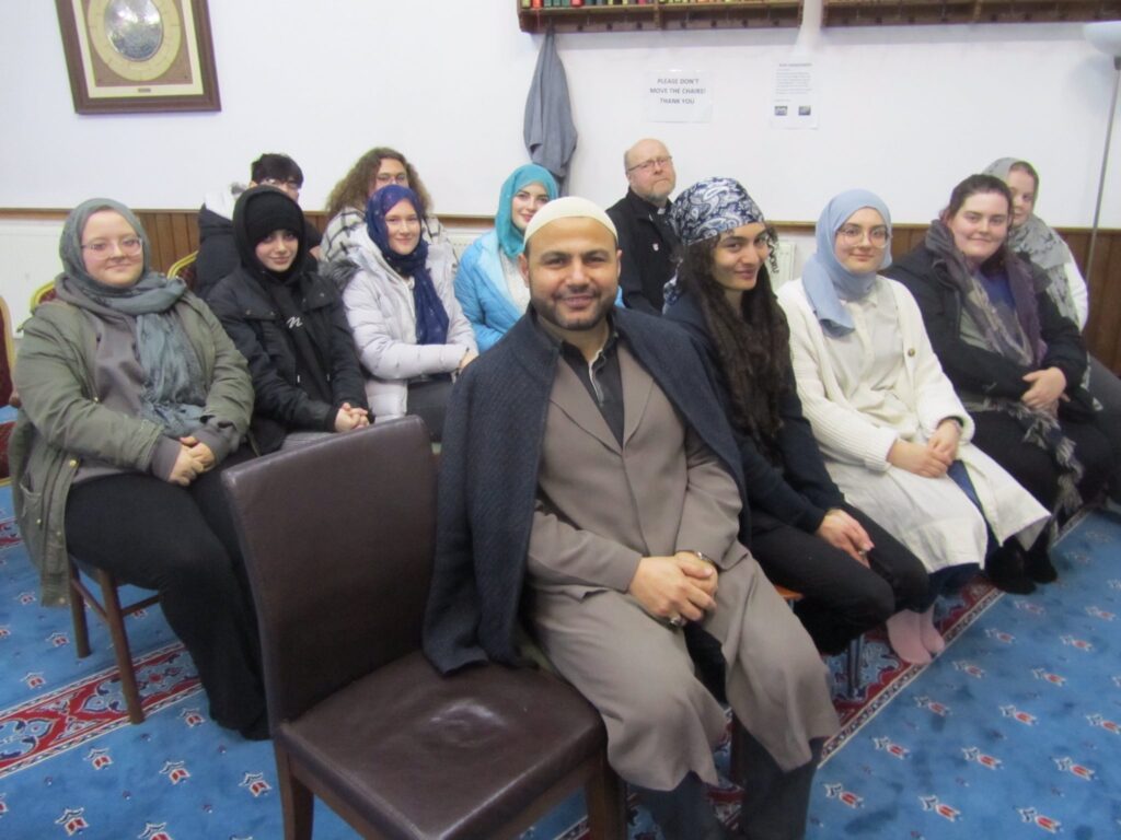 Imam Adam Kantar (front) with visitors to Rumi Mosque