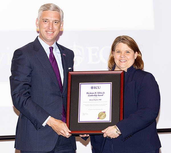 ECU Chancellor Philip Rogers presents Dr. Sharon Paynter with the James R. Talton Jr. Leadership Award.