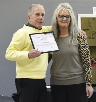 Retired Bell County Circuit Judge Robert Costanzo accepts his plaque from Annie Nierengarten during UNITE Bell County’s Celebration of Community Heroes Monday night at the Cratery City Hub. Costanzo, honored for his work with the Bell County Drug Court, was one of many individuals and organizations recognized for their efforts in the prevention, treatment and recovery of substance use disorders. (Photos by Jay Compton)