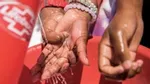 Hands washing under tap provided by Lifebuoy in a less economically developed country