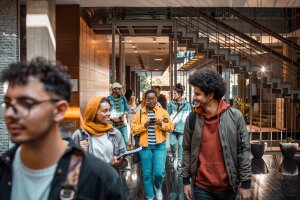 Close up of a group of college students entering the university