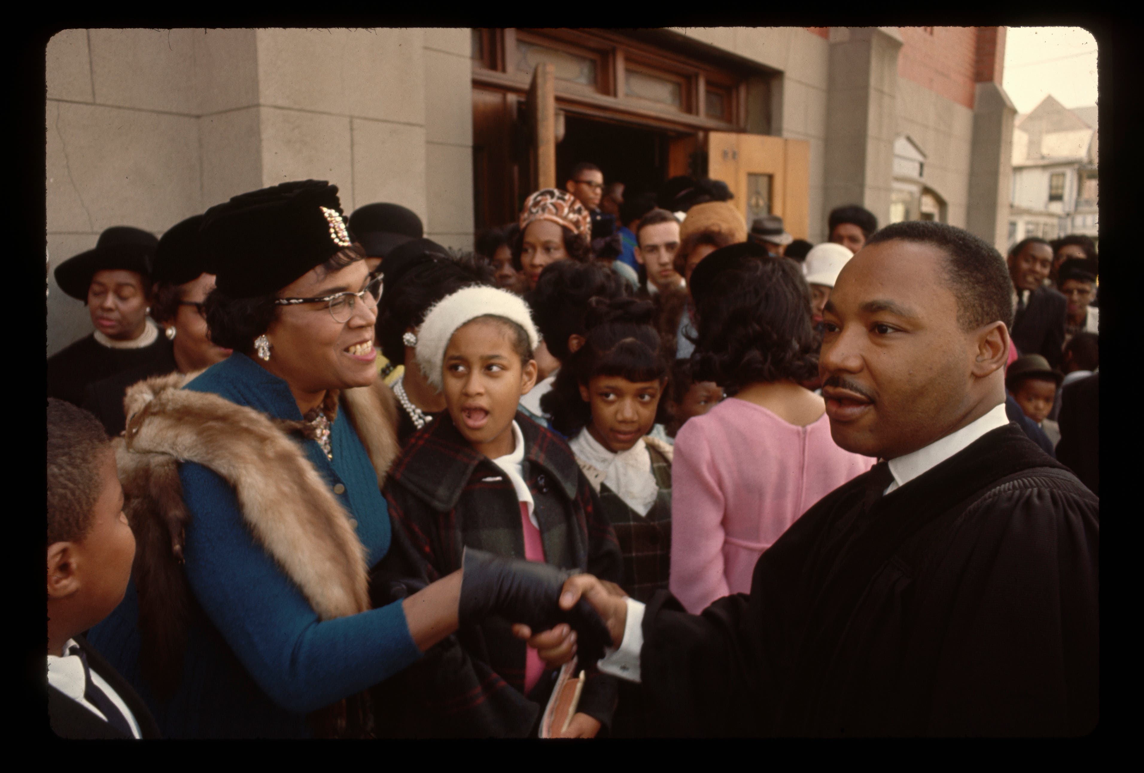 Reverend King Greeting Parishioners