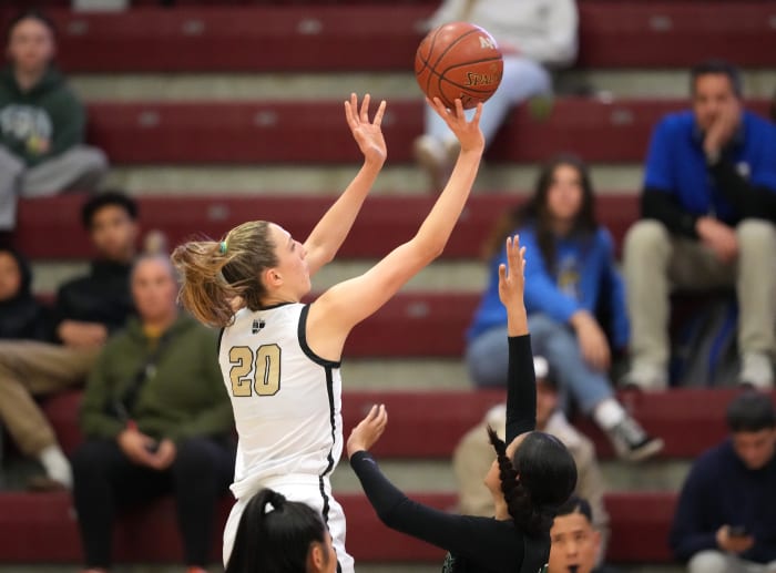 With picture-perfect form, McKenna Woliczko is superb in the low block, in the mid-range and on the break.