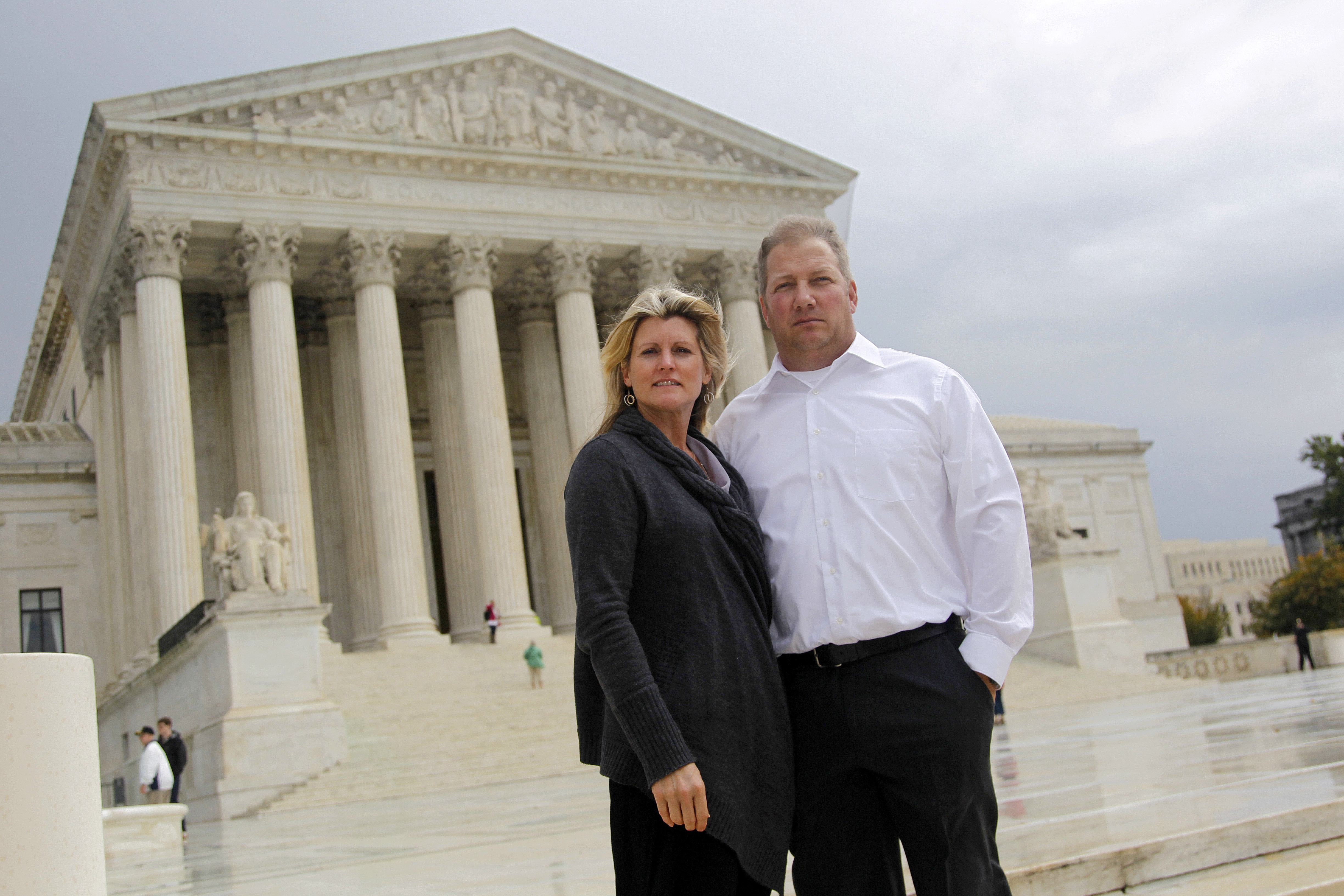 Michael and Chantell Sackett pose in front of the Supreme Court. Michael and Chantell Sackett pose in front of the Supreme Court.