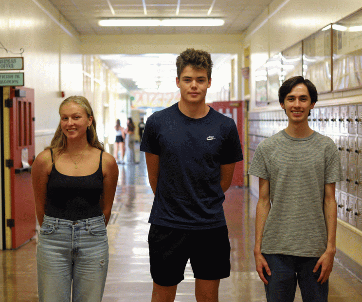 Three academic award winners stand in a hallway at Santa Barbara High School.