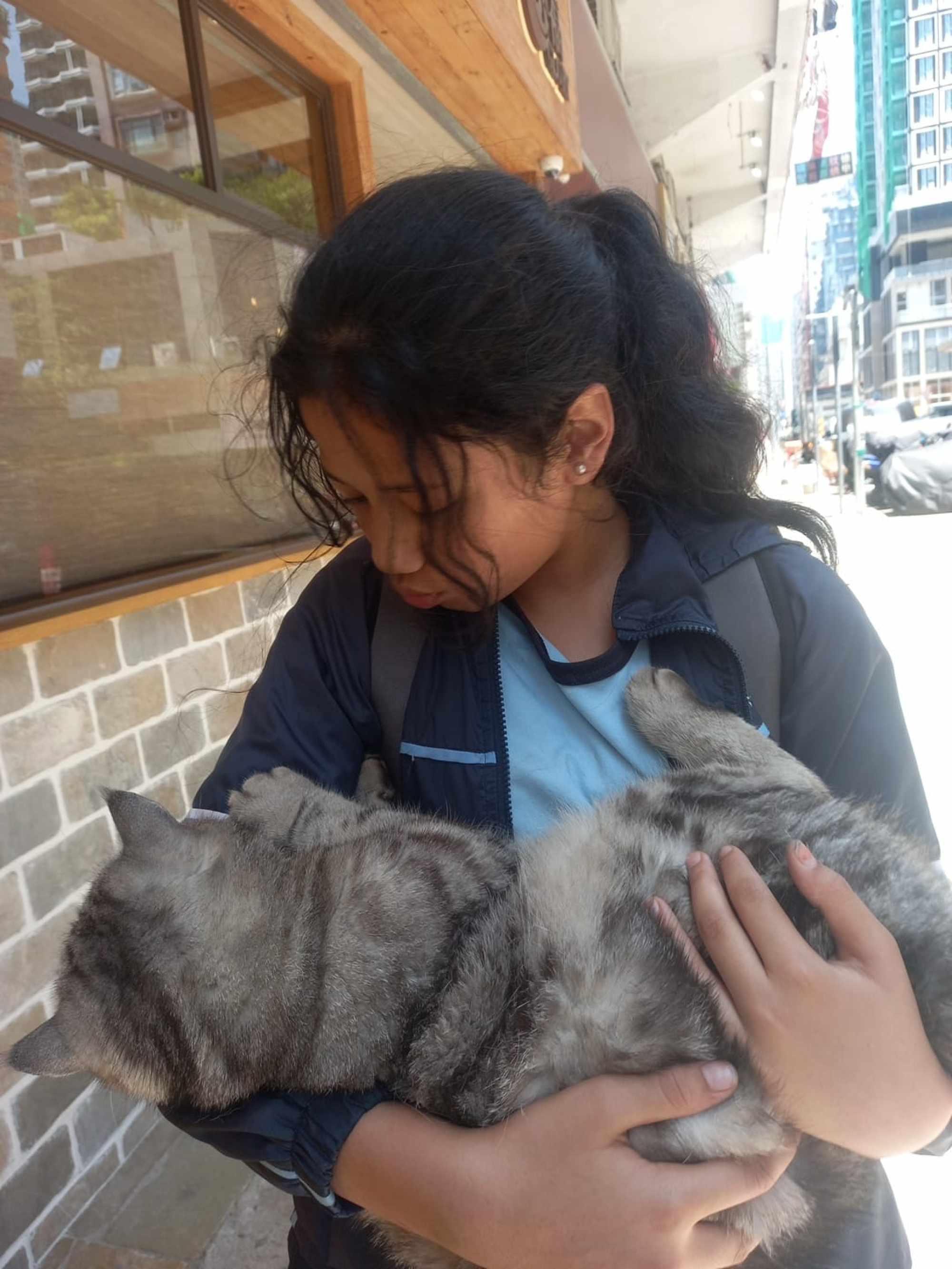 Hana was happy to help a kitten in need. Photo: Handout