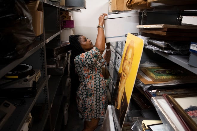 Renee Kesler, president of the Beck Cultural Exchange Center, looks through the large collection of Nikki Giovanni's personal and academic items in 2023.