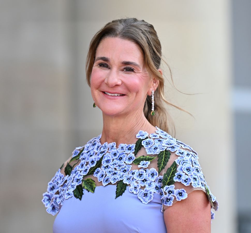 Woman with ponytail in light blue dress