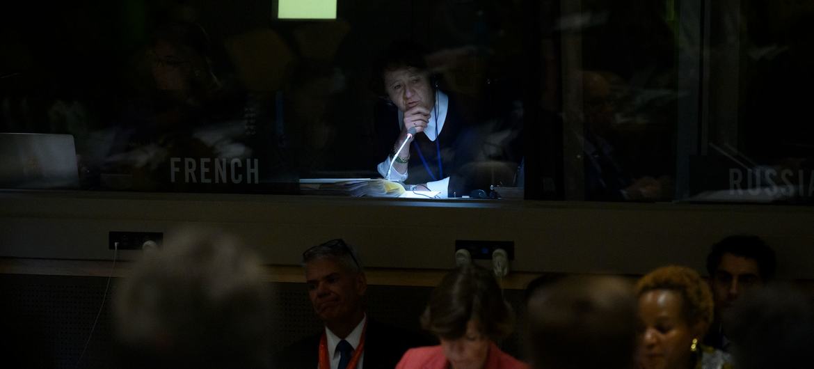 A UN interpreter works during a debate on international humanitarian law. A UN interpreter works during a debate on international humanitarian law.