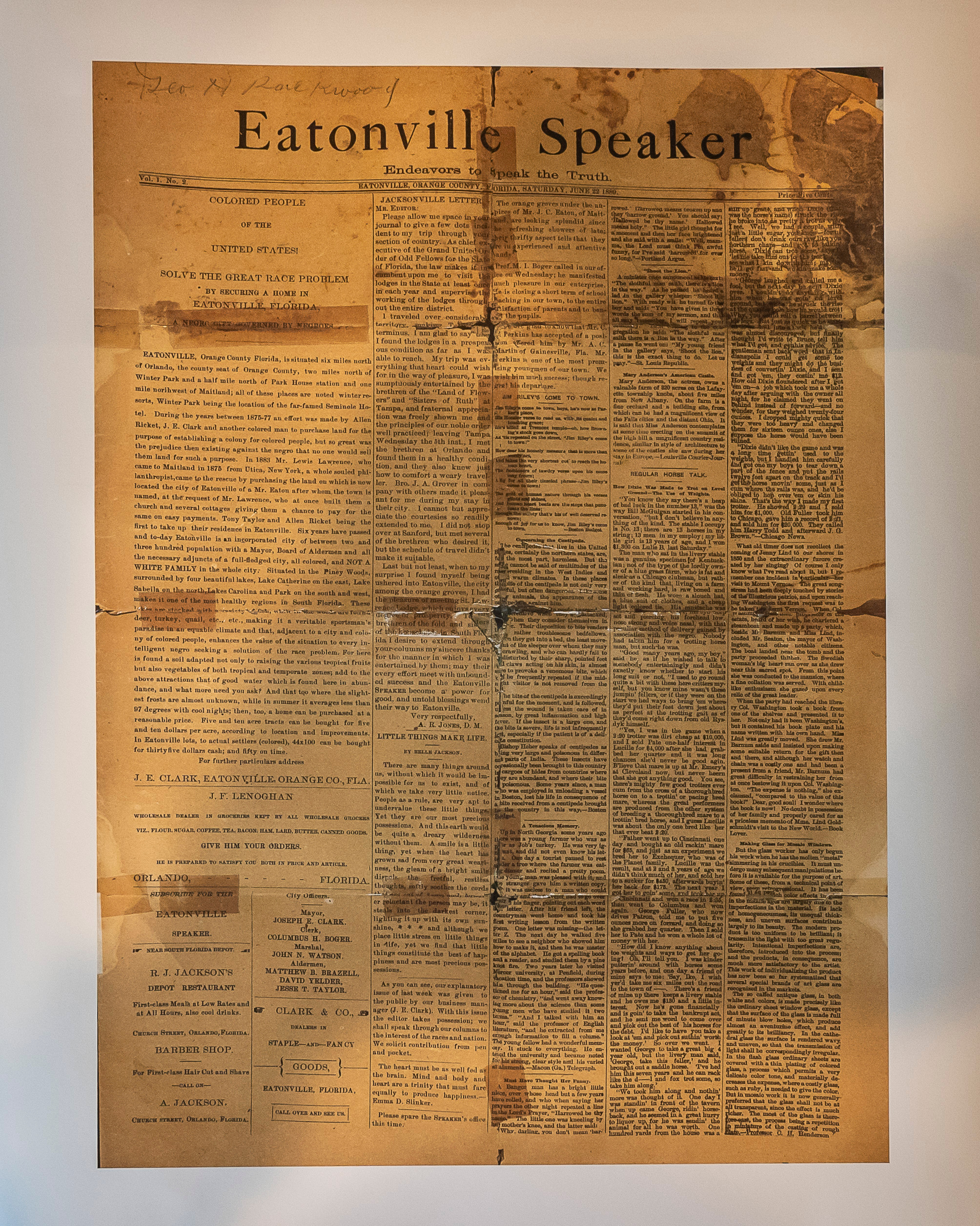 Preserved paper clipping held together with tape. 