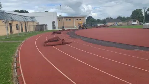 University of Oxford Differs on the red running track removing lanes. One lane has been removed.