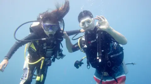 Jonathan Scott-Lee Caitlyn Scott-Lee scuba diving with her father