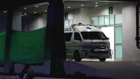 Reuters An ambulance parks at the entrance of Chiang Rai Prachanukroh hospital