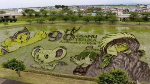 Kyodo News Manga artist Osamu Tezuka's most famous characters are created in a Japanese rice field