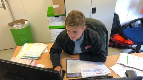 Kyran Brookes Quantity surveying apprentice Freddie Hoare at work in the Alun Griffiths office