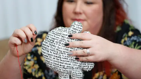 Tom Maddick/SWNS Jemma, working on one of her cushions as part of her masters project on child abuse