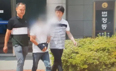news1 A man accused of beating his wife attends a local court in the southern city of Mokpo, South Korea