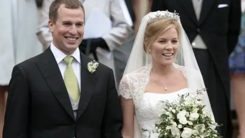 Shaun Curry/PA Wire Peter Phillips and his wife Autumn on their wedding day