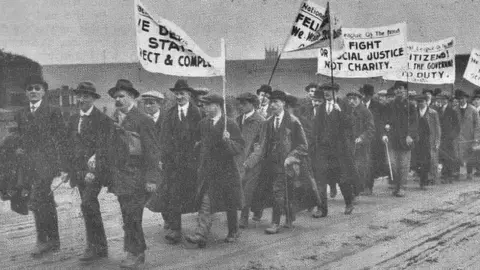 Daily Sketch Blind marchers with campaign banners
