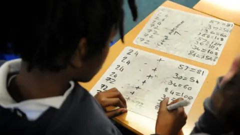 PA Media Generic stock image of pupil doing maths work in classroom