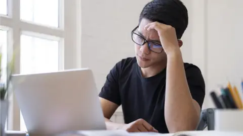 Getty Images teenager with laptop