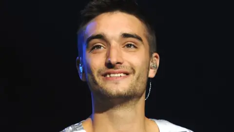 PA Media The Wanted singer Tom Parker in 2013