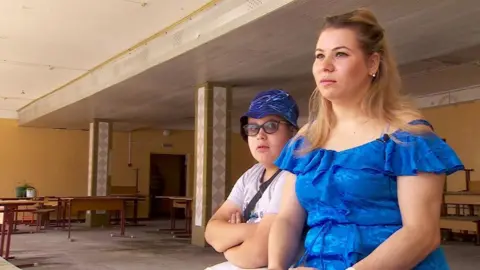 Maryna with her nine-year-old son, Daniil