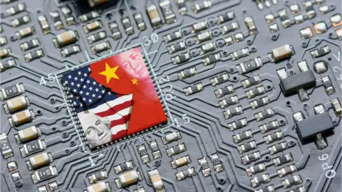 Getty Images Flag of USA and China on a processor, CPU or GPU microchip on a motherboard.