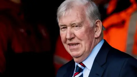 SNS John Greig