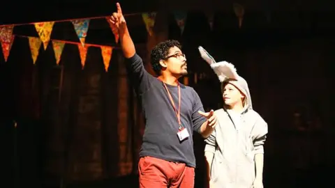 RSC Callum James (here being directed by the RSC's Robin Belfield, when he was playing Bottom in A Midsummer's Night Dream) says the RSC's programme gave him confidence