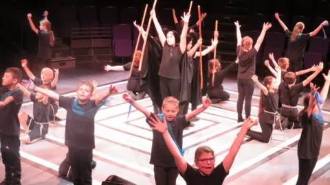 Springhead Primary School 10 year olds performing an extract from The Tempest around the theme of Prospero's magic and powers at the New Vic Theatre in Newcastle-under-Lyme