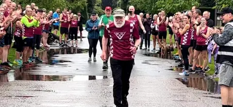 David Powles Rodney Freeburn taking part in Norwich Parkrun with members of Wymondham Athletics Club cheering him on