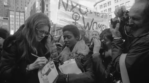 Getty Images Gloria Steinem with marchers in midtown Manhattan prior to the start of an International Women's Day March