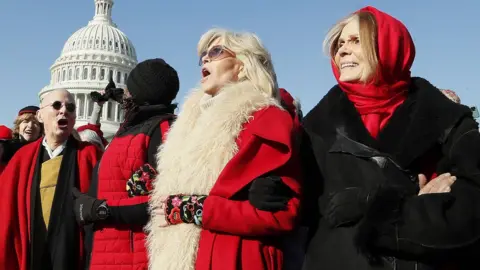Getty Images Actress and activist Jane Fonda (C) and Gloria Steinem (R) marches during the "Fire Drill Fridays" climate change protest and rally in Washington, in 2019
