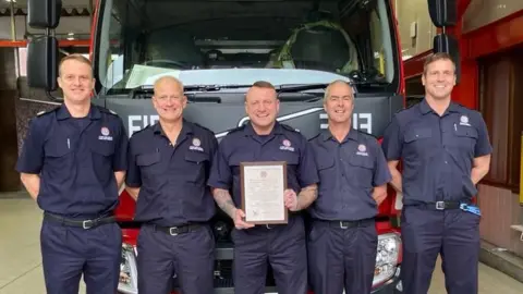 TWFRS Crew Manager Dave Irwin (centre) and colleagues from Red Watch at Birtley Community Fire Station