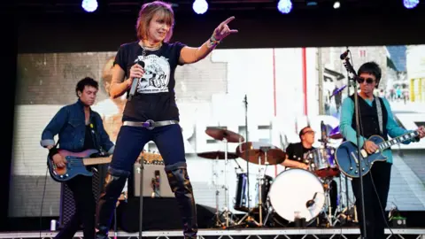 PA Media Johnny Marr with The Pretenders at Glastonbury