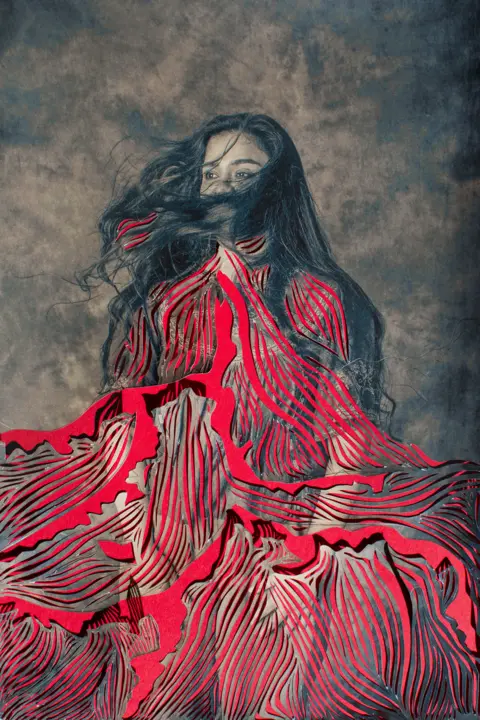 Sujata Setia A photographic portrait of a woman with artistic paper overlay