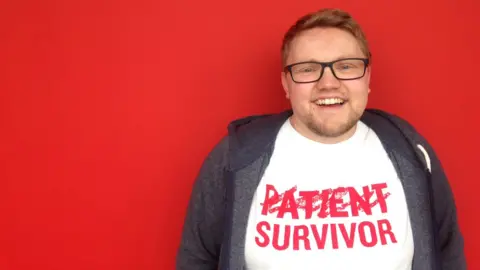 BBC red background and Stuart smiling
