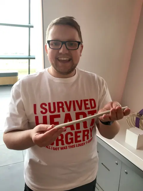 Stuart Hutchison Stuart holding a tube