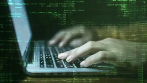 Getty Images Laptop with hands typing