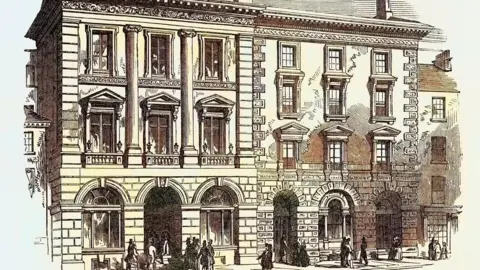 Sepia Times/Getty Images Sepia engraving of Italianate three-storey building with arched doorways to the ground floor and pillars to the first and second floors. Various people in Victorian clothing are visible on the adjacent road.